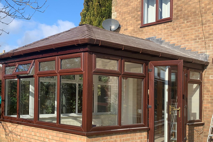 Conservatory with a new lightweight tiled roof