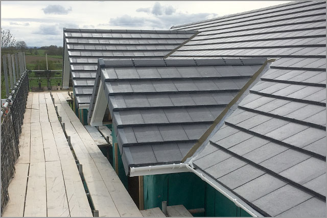 New-build roofs finished in grey concrete tile